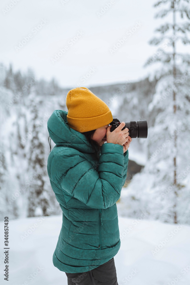Landscape photographer capturing a snowy Lapland Landscape photographer capturing a snowy Lapland