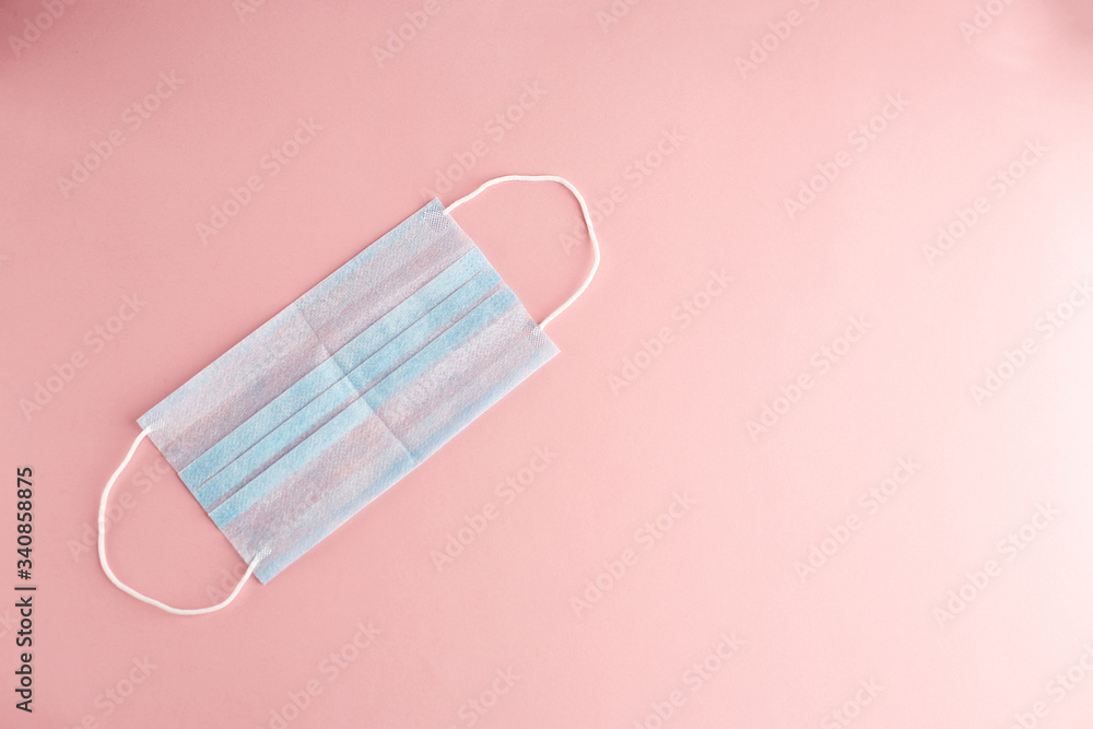 Pair of latex medical gloves and surgical ear-loop mask on white background. Protection concept Pair of latex medical gloves and surgical ear-loop mask on white background. Protection concept