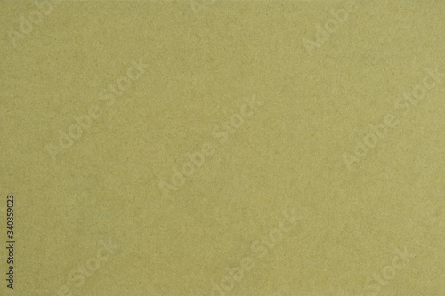 Background and texture of empty brown color paper sheet, on horizontal view.