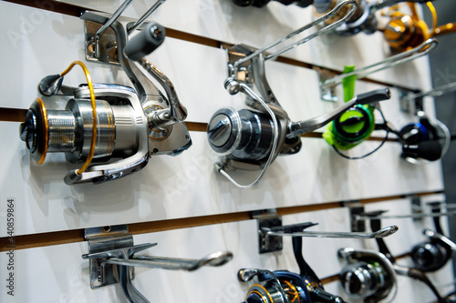 A variety of fishing reels. Fishing gear and accessories. photo