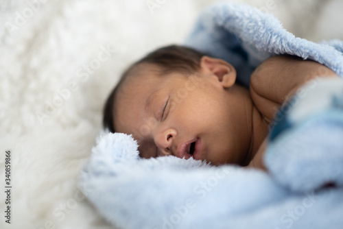 The baby is sleeping on a s...