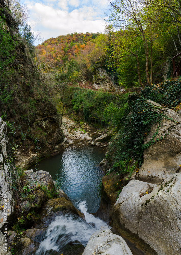 Panoramic view of San Fele waterfalls in a natural landscape, a popular hiking destination in Basilicata, Southern Italy