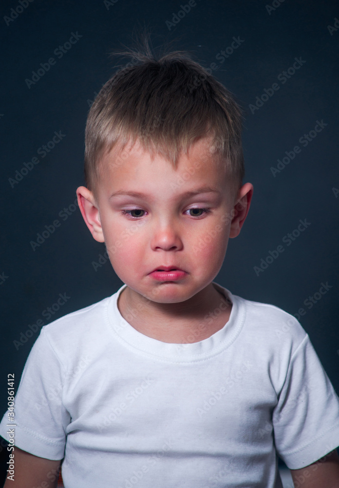 portrait of a boy with tears and resentment on his face portrait of a boy with tears and resentment on his face
