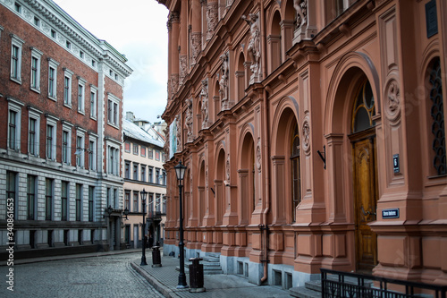 Beautiful Riga city architecture with old buildings and brick streets.