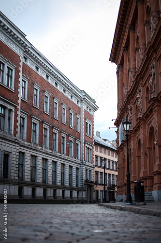 Beautiful Riga city architecture with old buildings and brick streets.