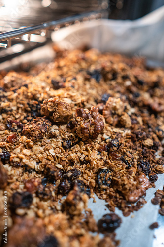 granola to cook in an electric oven. concept of simple ingredients for healthy breakfast