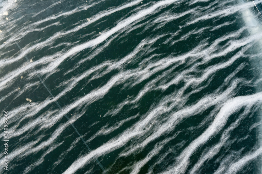 Fototapeta premium Striped ice on lake Baukal closeup