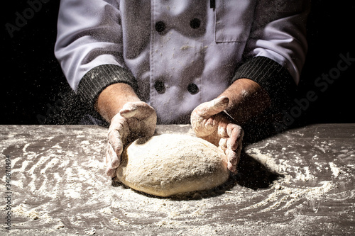 Fototapeta Naklejka Na Ścianę i Meble -  pizza prepare dough hand topping. chef prepares the dough with flour