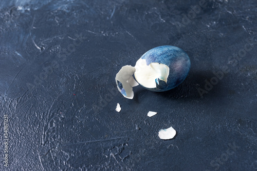 broken boiled egg large bright blue chicken eggs on a beautiful background photo