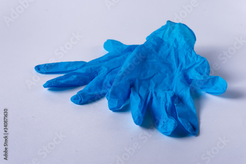  blue medical gloves on a white background © Александр Захаров
