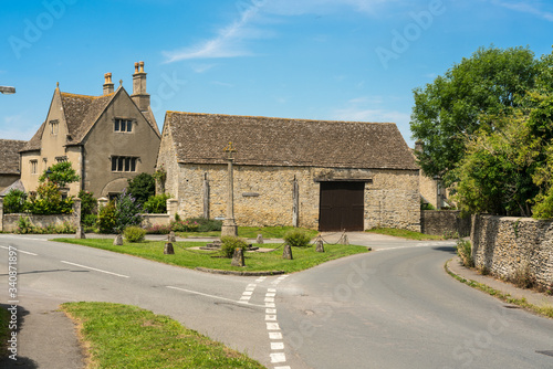 Hillesley, Gloucestershire, Cotswolds, England, United Kingdom. View of the crossroads and the War Memorial.
