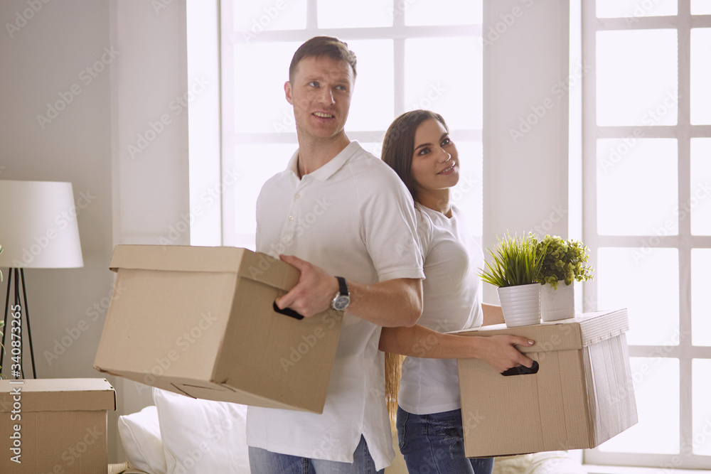 happy Young couple moving in new home happy Young couple moving in new home