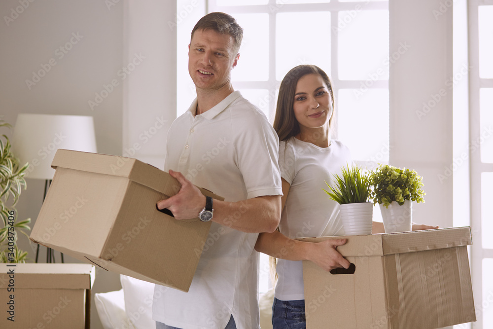 happy Young couple moving in new home happy Young couple moving in new home