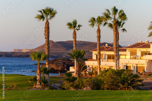 View on evergreen grass field on large golf course and blue Atlantic ocean on Tenerife island  Canary  Spain