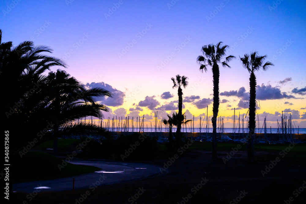 Obraz premium Lifestyle background, yachts and sail boats in ocean harbour on tropical island on sunrise