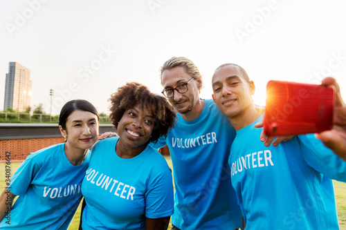 Diverse volunteers taking a selfie together