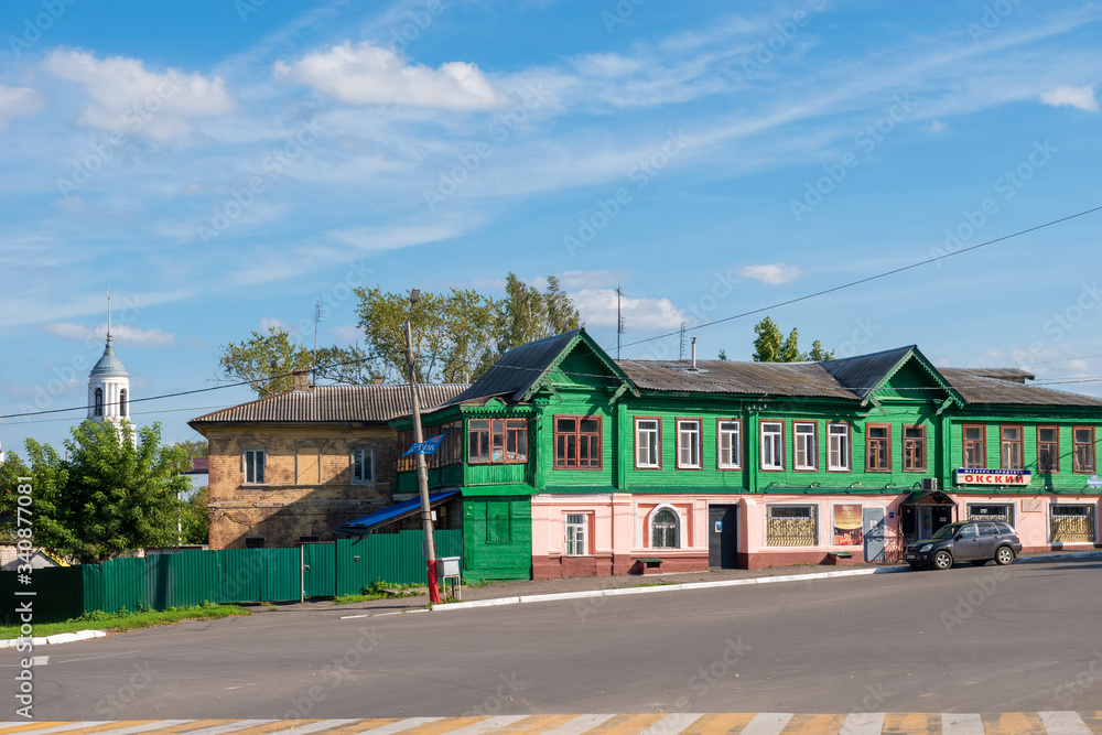 Naklejka premium MUROM, RUSSIA - AUGUST 24, 2019: Old residential building with shops on the ground floor. Pervomaiskaya Street 10