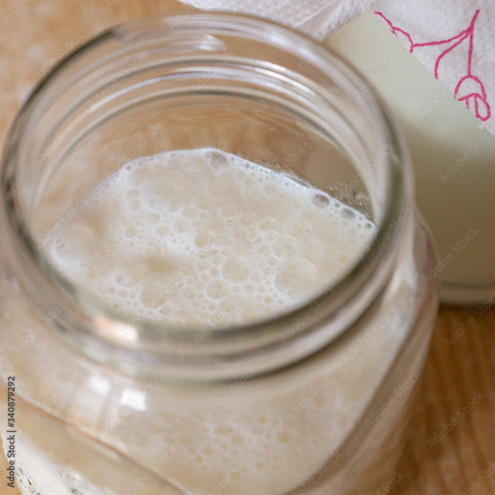 Freshly made kefir strained from starter grains. Organic farm milk used for home production of healthy sour carbonated drink rich in good probiotic bacteria for gut. Optionally vegan with any nut milk Freshly made kefir strained from starter grains. Organic farm milk used for home production of healthy sour carbonated drink rich in good probiotic bacteria for gut. Optionally vegan with any nut milk