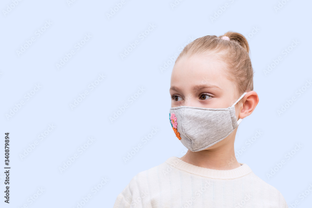Girl with handmade mask to protect her from Corona virus. Corona virus pandemic. Girl with handmade mask to protect her from Corona virus. Corona virus pandemic.