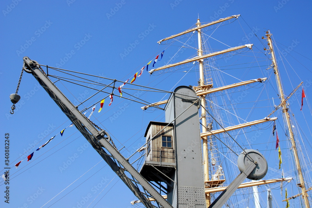 sailing ship mast and loading crane