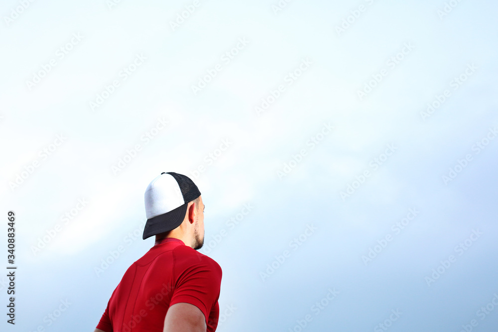 A lonely man. The man is looking at the sky.
A lonely man. The man is looking at the sky.
