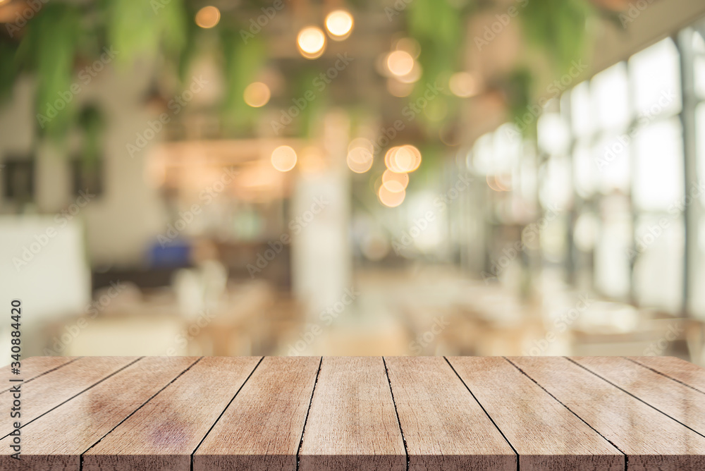 Wooden top table with bokeh light effect and blur restaurant on background. wooden table die-cut with clipping path Wooden top table with bokeh light effect and blur restaurant on background. wooden table die-cut with clipping path