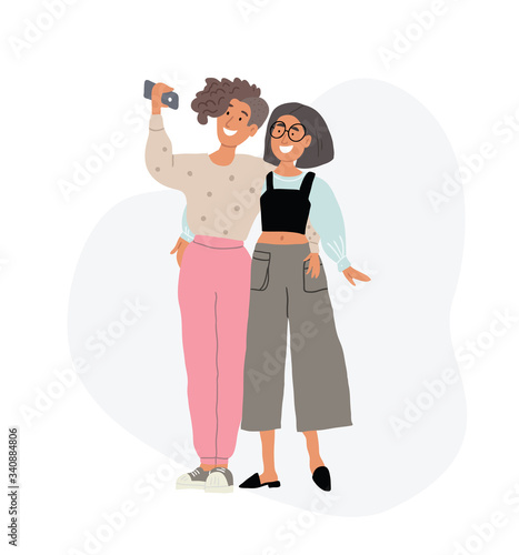 two lesbian girls hugging, taking selfie together