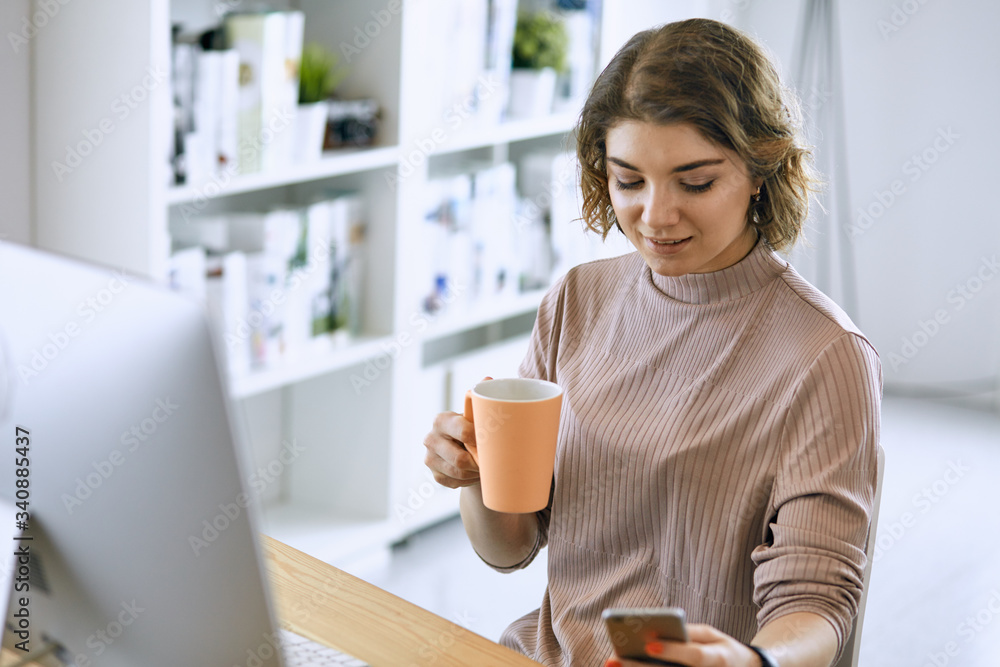 Young woman working with graphic tablet in office Young woman working with graphic tablet in office