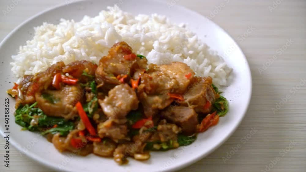 stir-fried crispy pork belly and basil with rice - Asian local street food style stir-fried crispy pork belly and basil with rice - Asian local street food style
