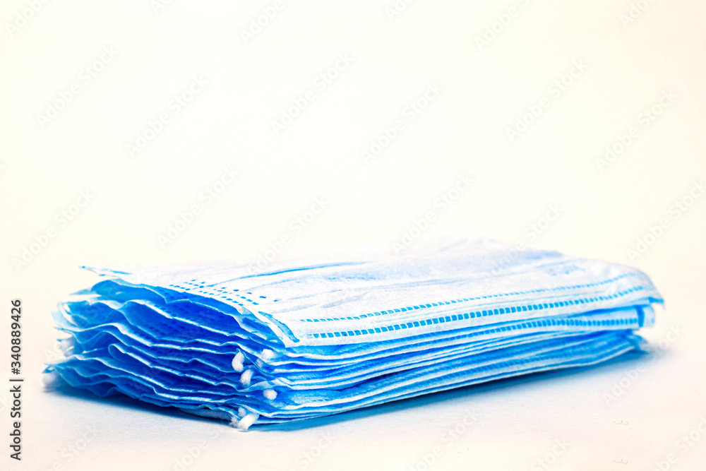 stack of medical hygiene masks on the white background stack of medical hygiene masks on the white background