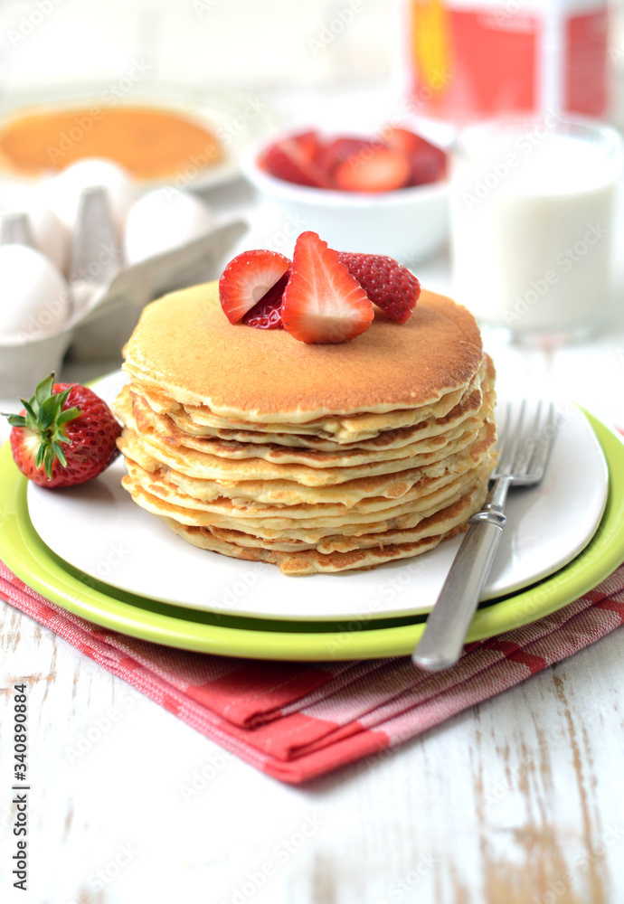 freshly prepared pancakes with strawberries freshly prepared pancakes with strawberries