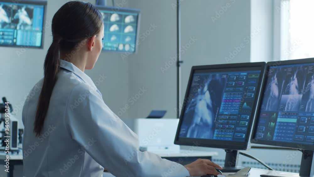 Medical doctors working in hospital office making computer research. Medicine, healthcare and technology concept. Medical doctors working in hospital office making computer research. Medicine, healthcare and technology concept.
