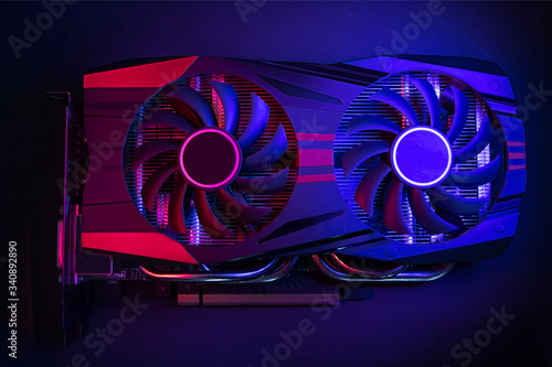 Photo of the graphic card is made in the style of cyberpunk. Red-blue background