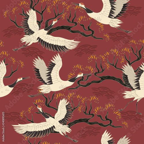 Seamless pattern with cranes birds and trees. Vector graphics