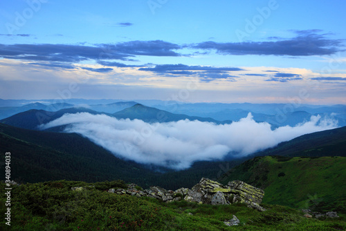 Beautiful sky with clouds and fog over the Carpathians. © Vitalfoto