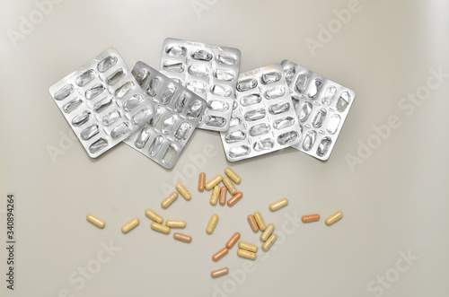 Assortedpharmaceuticals antibiotics pills medicine. colorful antibacterials pills on beige background. capsule pill medicine. Simbol of 2020 year, cronavirus broblem