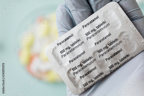 Pharmacist holding paracetamol pain killers photo