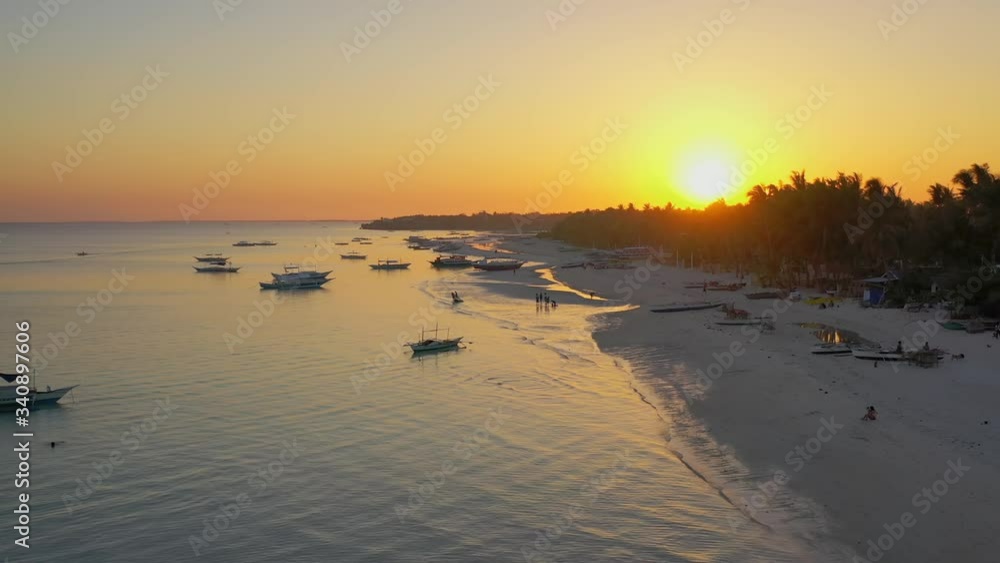 Magnificent aerial panoramic view of Boracay island beach toward bright white sun with yellow halo Magnificent aerial panoramic view of Boracay island beach toward bright white sun with yellow halo