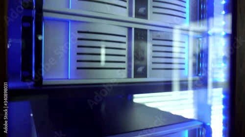 Moving shot of a server closet. 