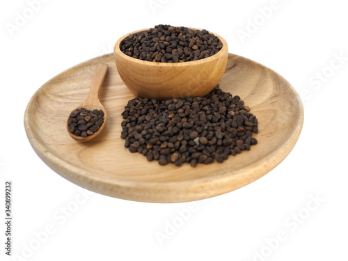 The Seed Morning Glory seeds placed in a wooden tray, wooden spoon, wooden cup on a white background
