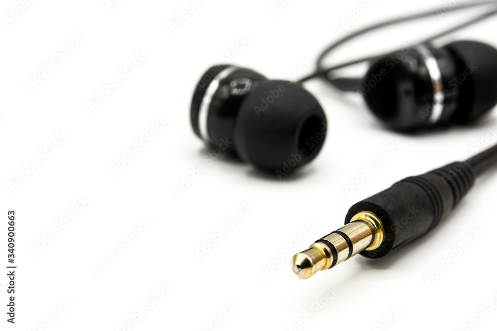 Black earphones isolated on white background. Copy space Black earphones isolated on white background. Copy space