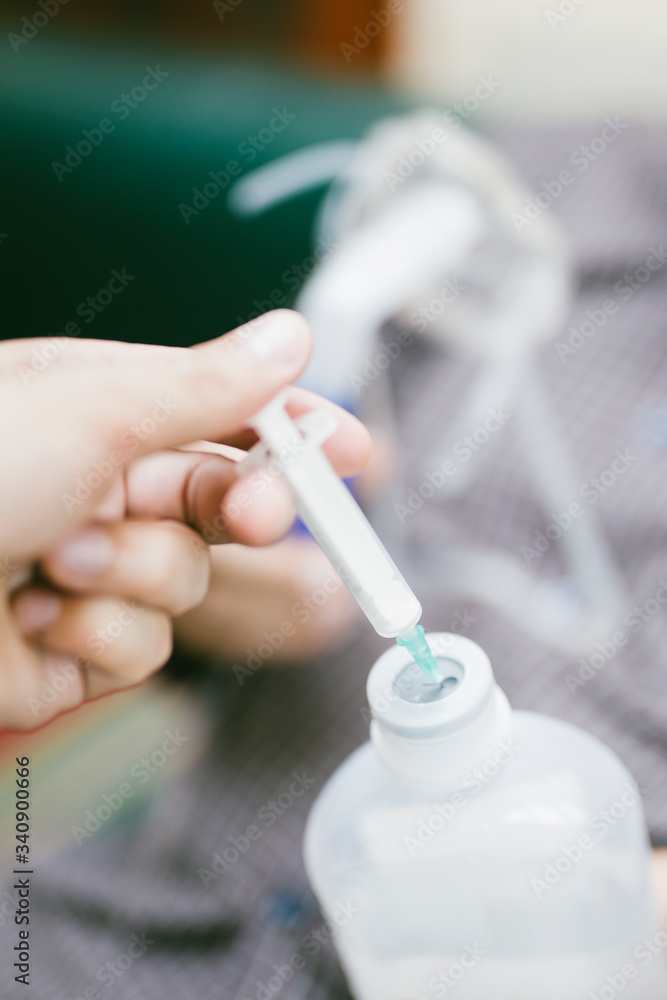 Preparation of compressor nebulizer for use on senior man with respiratory mask, nebulizer Preparation of compressor nebulizer for use on senior man with respiratory mask, nebulizer