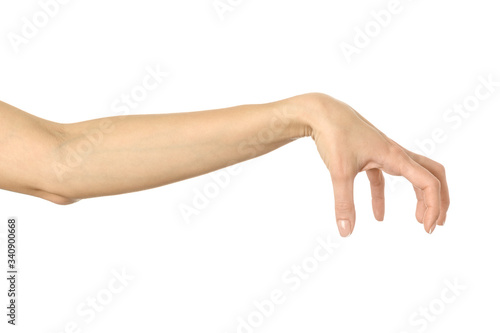 Hand picking, holding, grabbing or reaching. Woman hand gesturing isolated on white