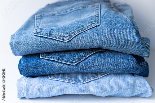 Modern blue jeans on white background