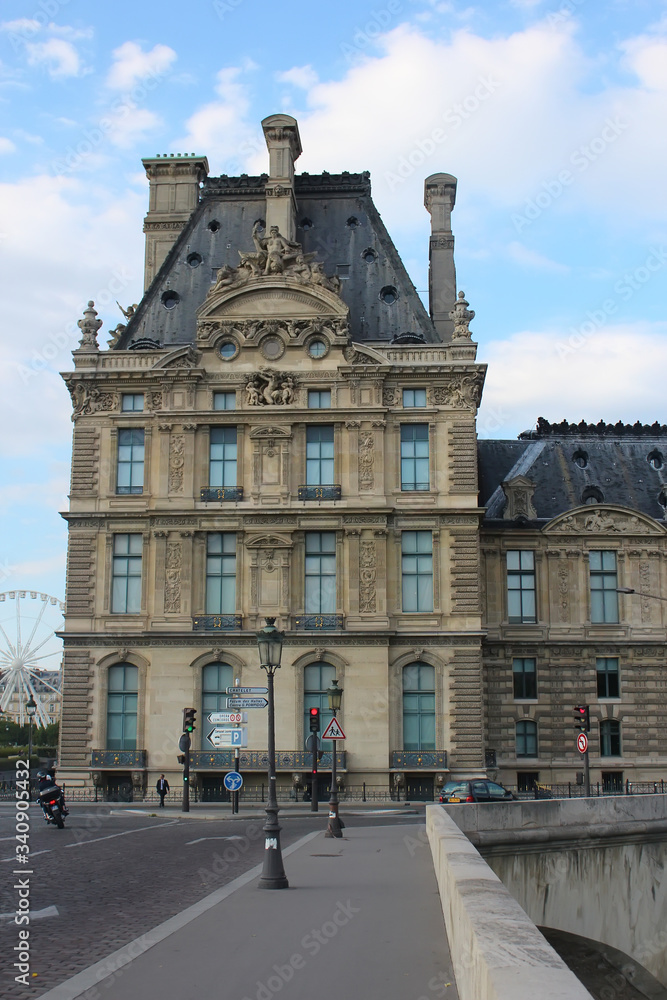 Paris, France - August 26, 2019: The Louvre building and the Royal Bridge.