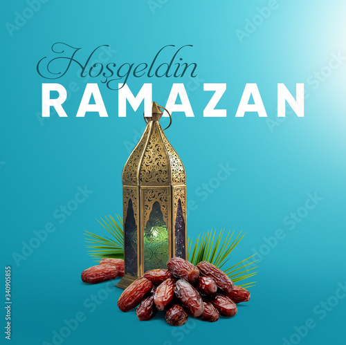 Welcome Ramadan (Turkish: Hosgeldin Ramazan) creative greeting card. Holy month of muslim community Fresh blue background with lantern, dates fruit and palm leaf. photo