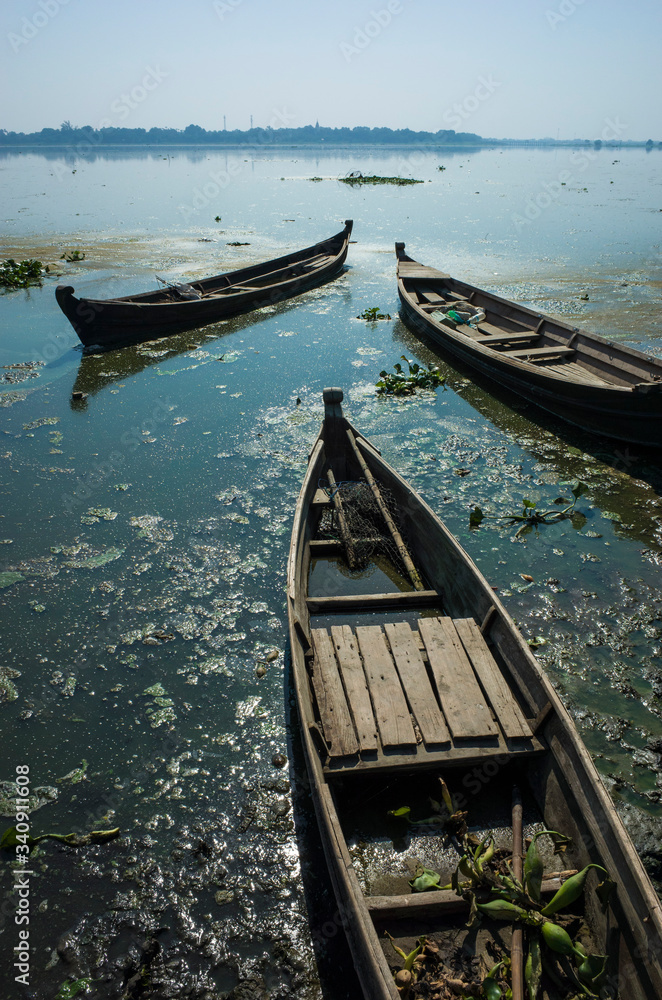 Abandoned wooden fishing boats on Taung Tha Man Lake at Amarapura, Mandalay, Myanmar
