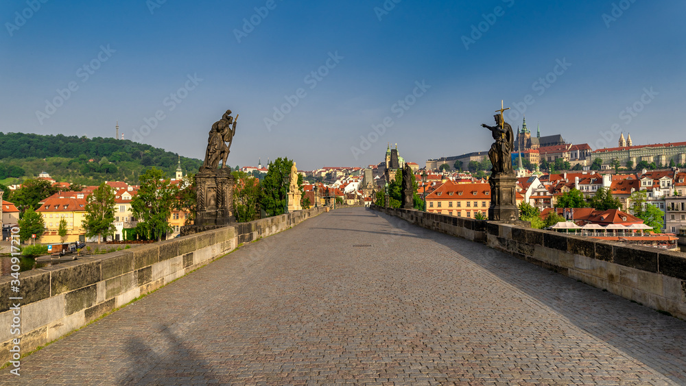 Morning view of Charles Bridge in Prague, Czech Republic. The Charles Bridge is one of the most visited sights in Prague.