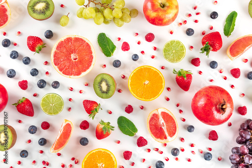 Fototapeta Naklejka Na Ścianę i Meble -  Fresh summer fruit, a flat lay on a white background, vibrant food pattern, overhead shot
