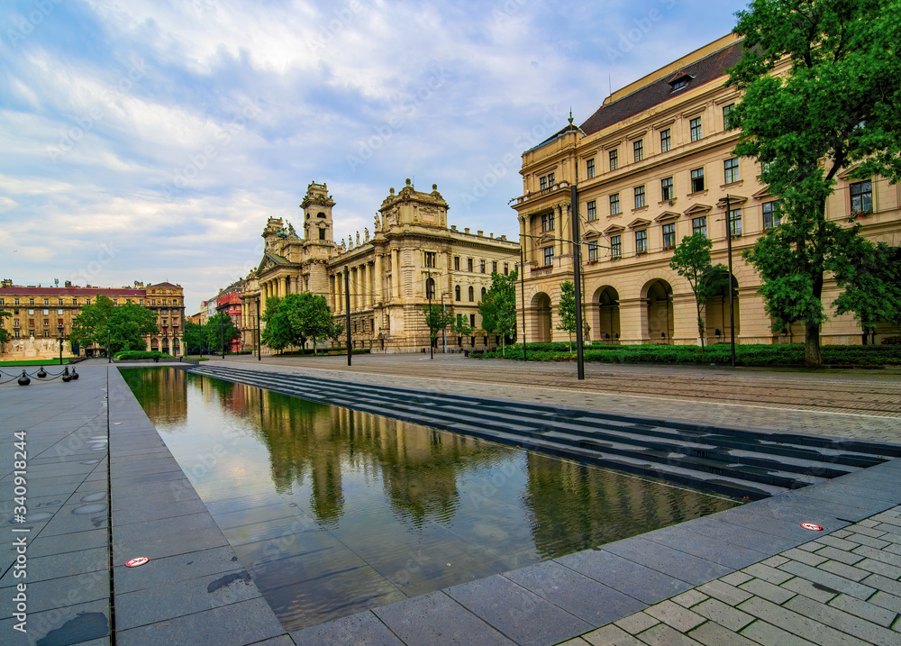Awesome building of Former Ministry of Justice mirrored in large reflecting pool on Kossuth Square, Budapest, Hungary